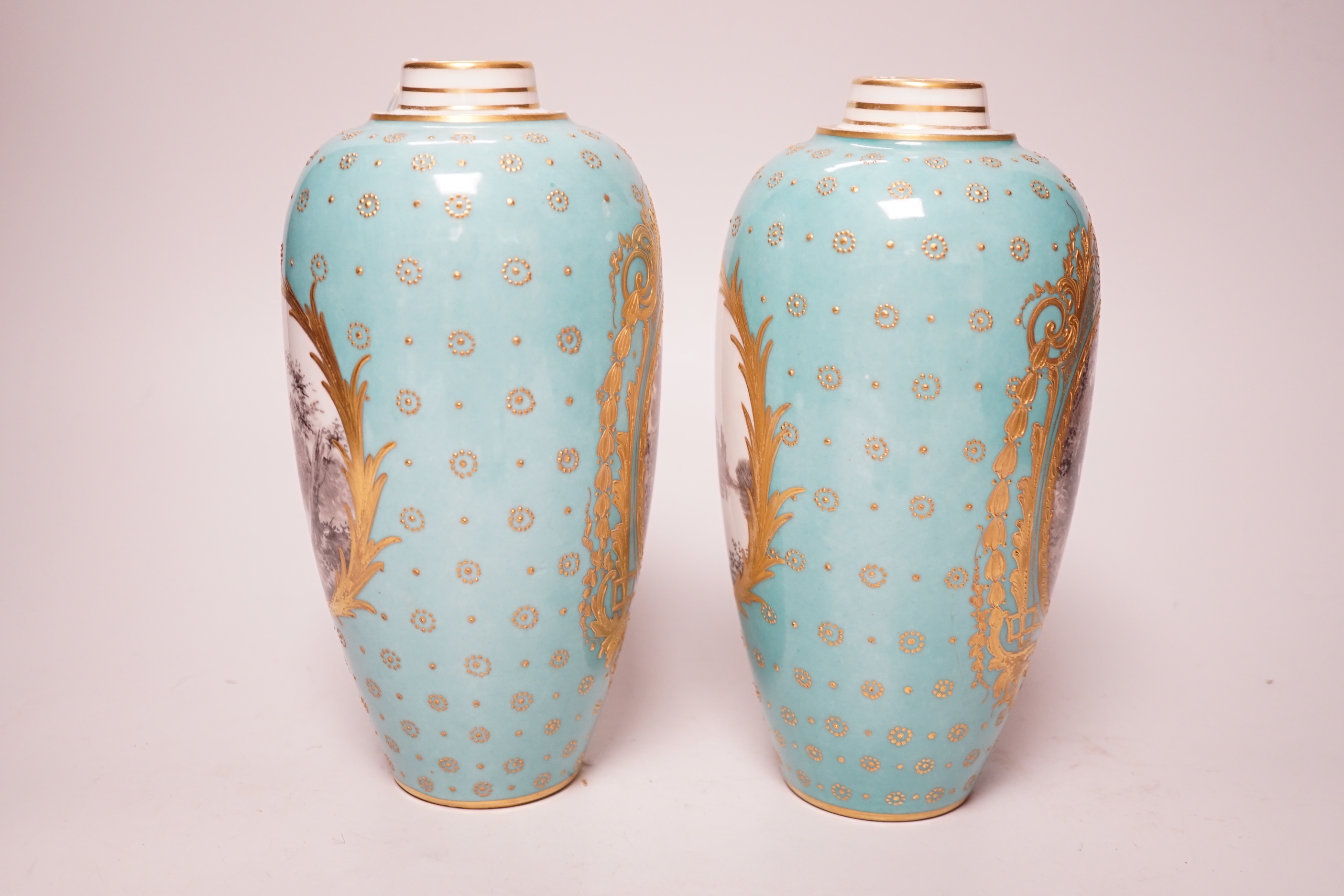 A pair of late 19th century Sevres style turquoise ground vases and covers, 24cm